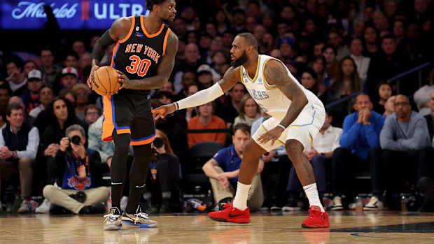 Lakers forward LeBron James defends Knicks forward Julius Randle.